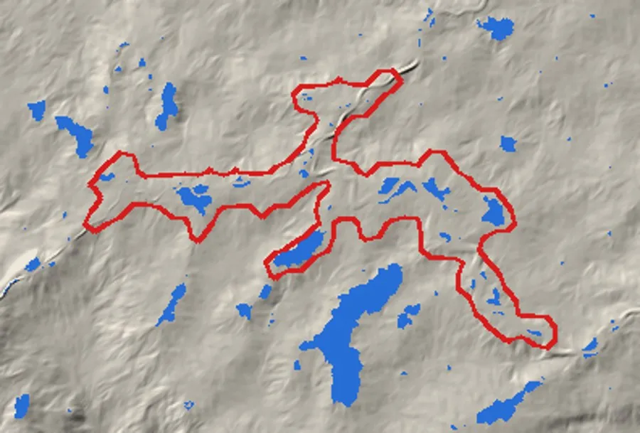 Shaded relief of rolling ground with a red outline of a branching hollow, mostly dry inside, and scattered blue patches of standing water, the largest outside the outline