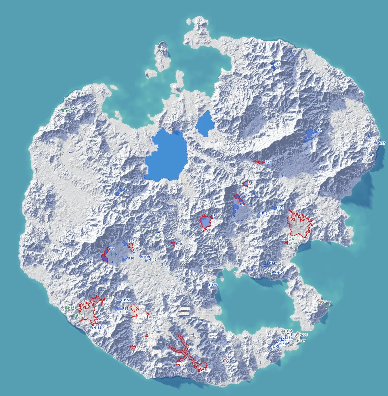 Paper relief map of the island with its three lakes in blue, the planned lakes and ponds coloured, dry salt flats pale, and basins with no lake in grey