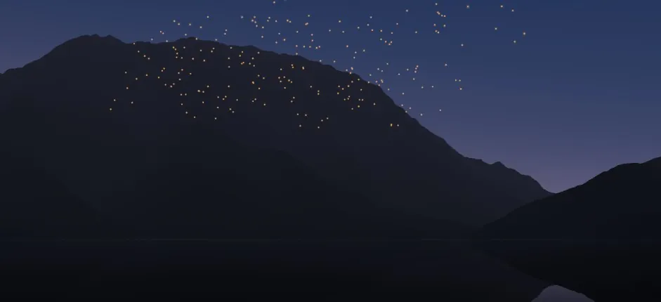 From a boat on the lake at dusk: hundreds of small warm lanterns drifting up in front of a dark mountain ridge and into a deep blue sky