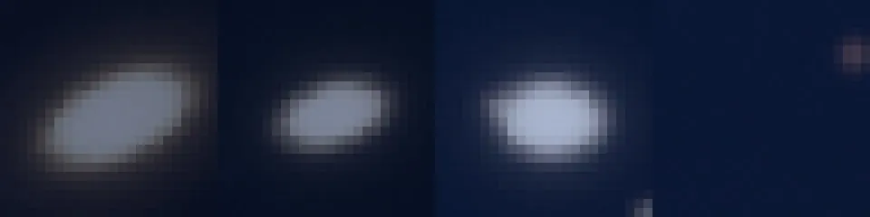 Four enlarged crops of bright stars from an earlier version: each star is an oval smear, all tilted the same way.